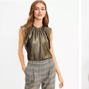 Loft shimmering shell with flattering flutter sleeves. Size Large. Like new.